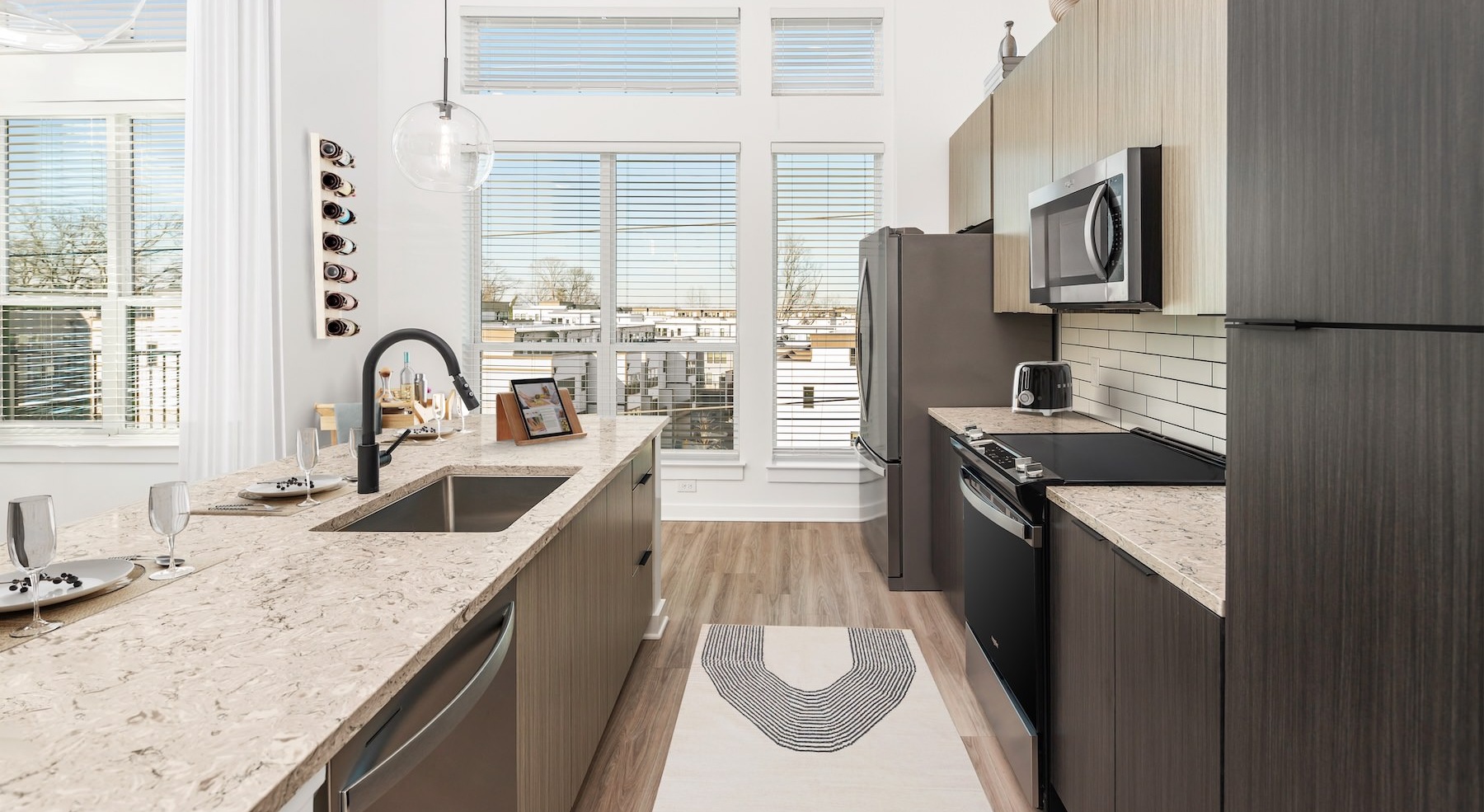 Contemporary kitchen with quartz countertops and stainless-steel appliances