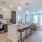 a kitchen with a bar stool and a table