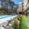 outdoor bag toss, pool, and sitting area