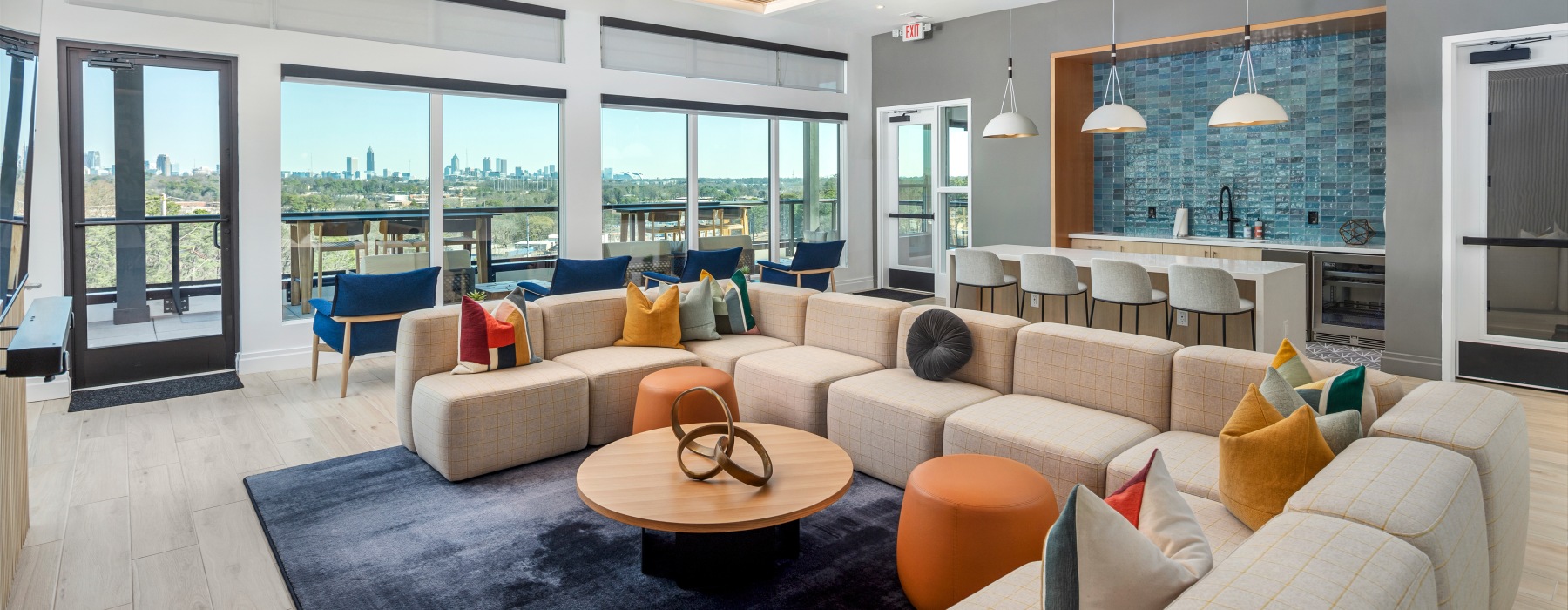 community space with sitting area and kitchen