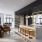 a modern looking kitchen with a bar and chairs