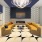 a large living room with a large glass wall and a large chandelier